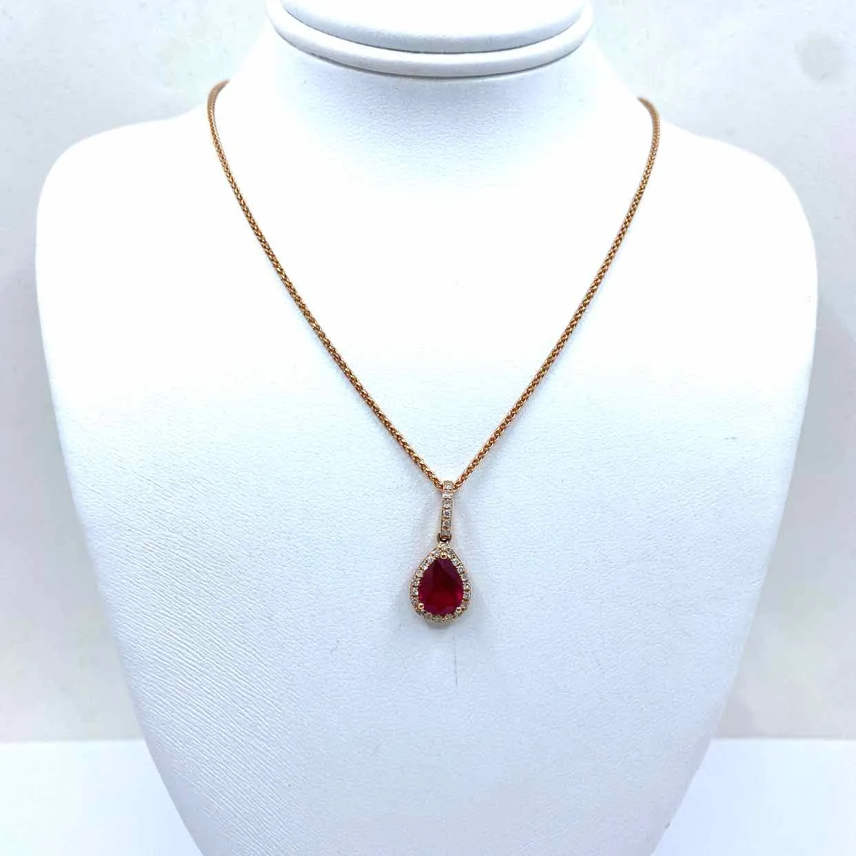 14KR ROSE GOLD PEAR RUBY & DIAMOND HALO NECKLACE