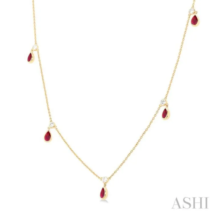 1/8 ctw Round Cut Diamonds and 5X3MM Pear Shape Ruby Precious Station Necklace in 10K Yellow Gold